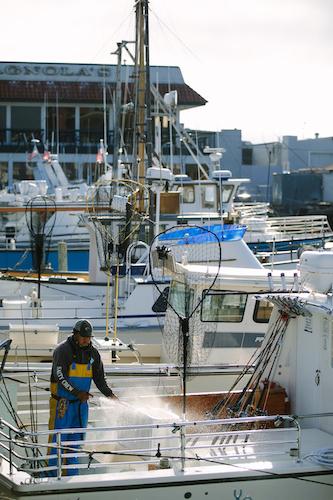 Man standing on a sport fishing vessel