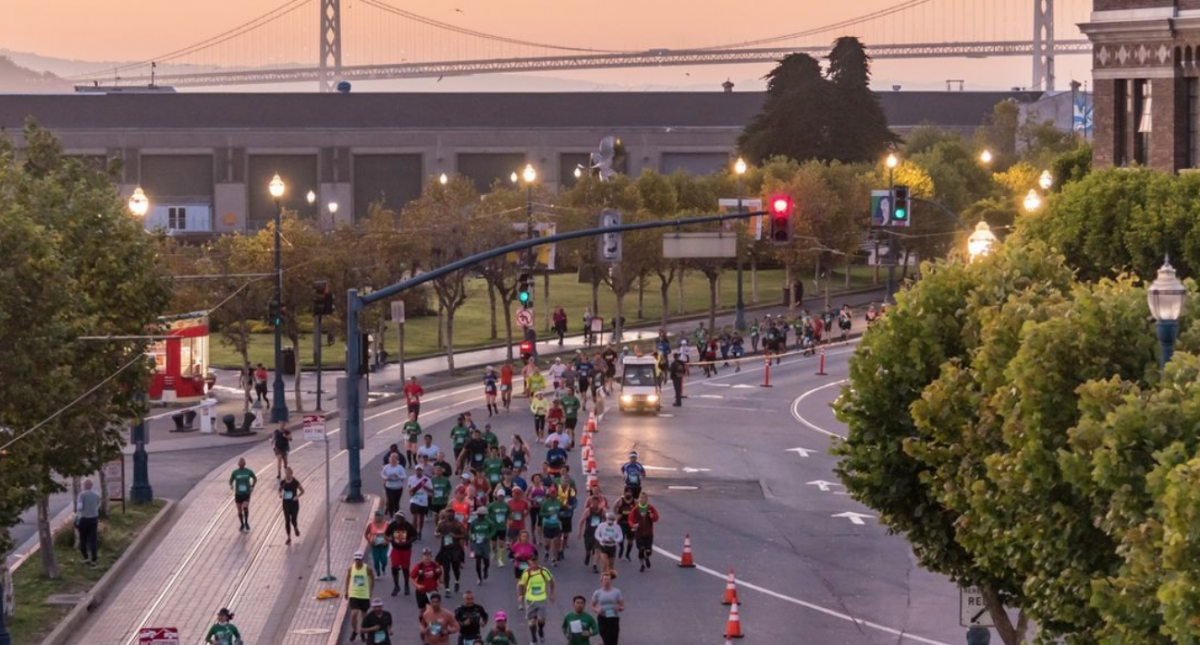 Marathoners running on the Embarcadero in the early morning, photo credit to SF Marathon