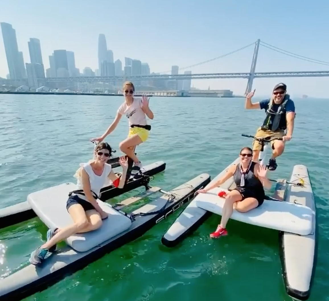 spinout_fitness_ig.png People water biking near the Bay Bridge, photo credit to SpinOut Fitness