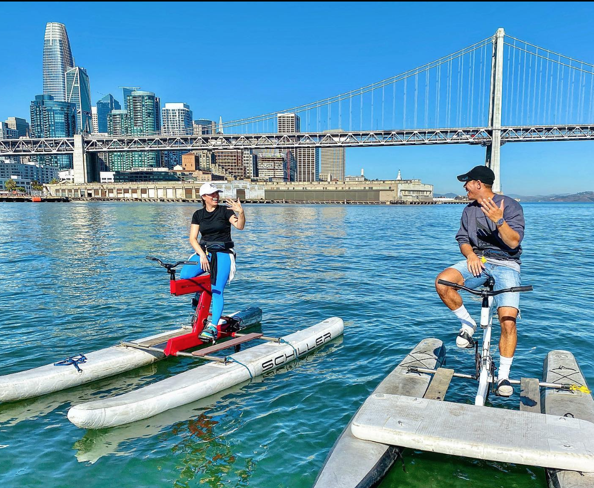 Couple on waterbikes, photo credit to SpinOut Fitness