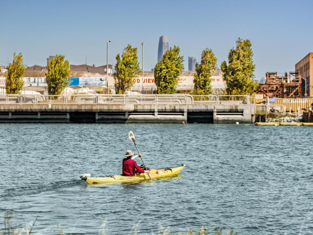 p1211830_person_in_kayak_in_islais_creek_1.jpg Kayaker paddles in Islais Creek