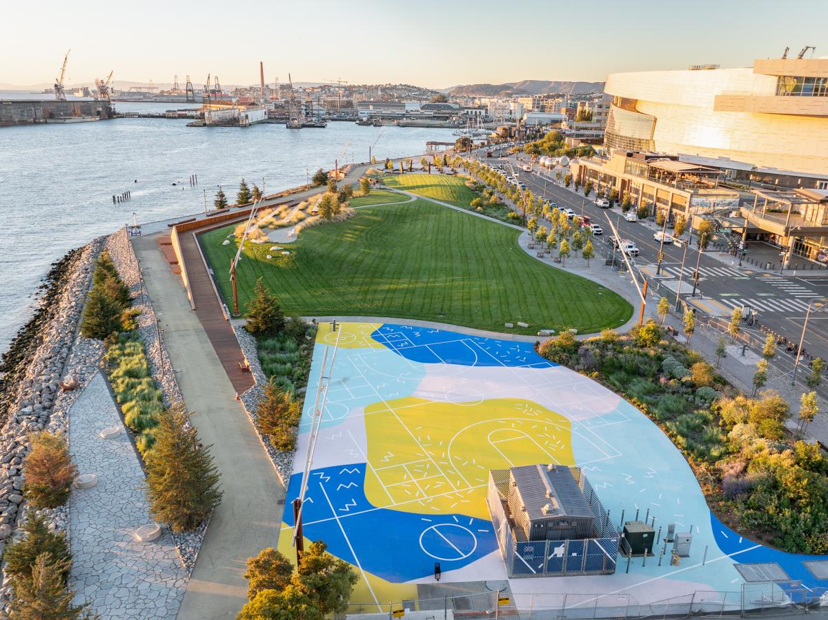 The large grass area and paved play area at Bayfront Park