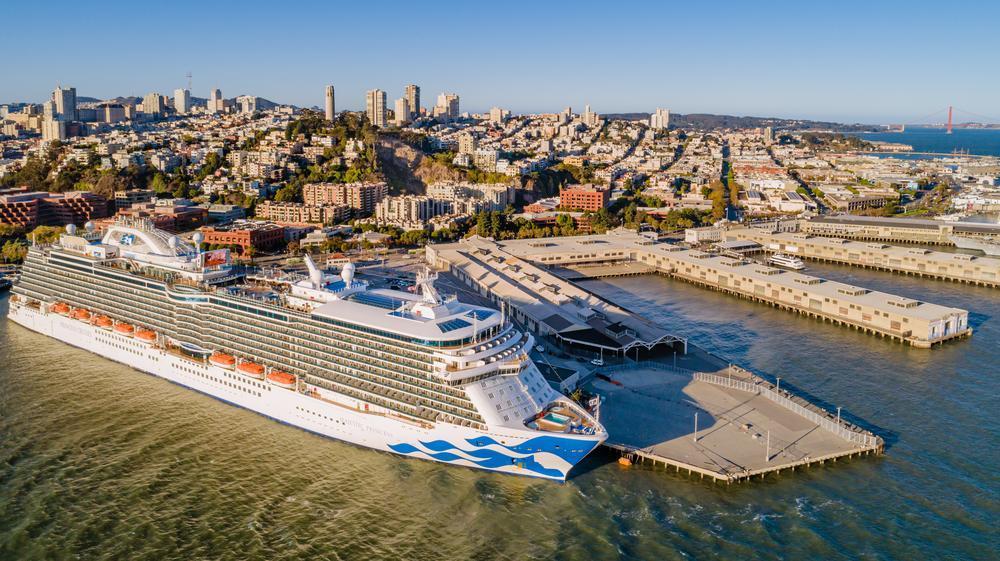 Princess Cruise ship berths at Pier 27 on a cloudless day by the bay.