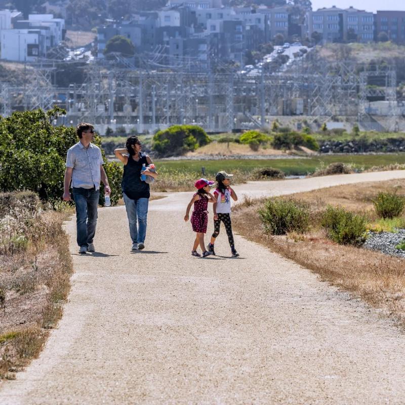 People walking at Heron's Head Park